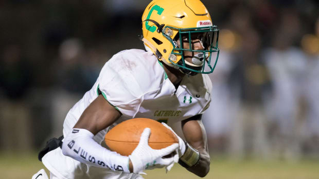 Damarius Mcghee (6) carries the ball during the Catholic vs Milton football game at Milton High School on Friday, Nov. 1, 2019. Catholic Vs Milton Football